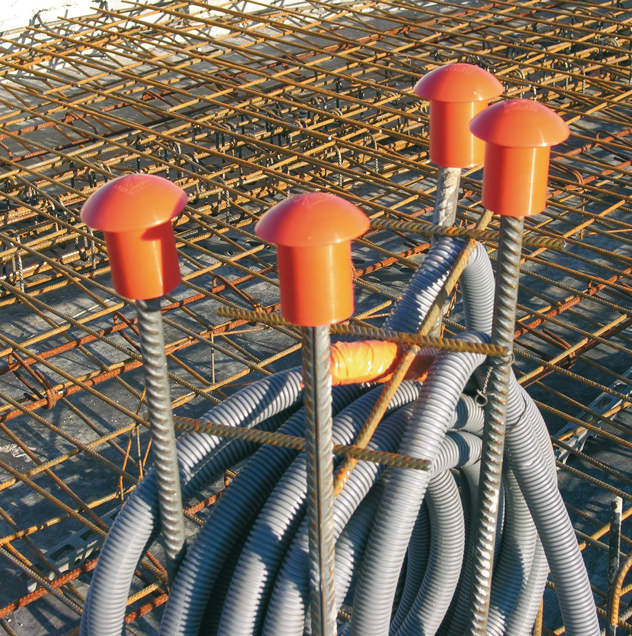 PROTECTIONS FOR CONCRETE REINFORCEMENT